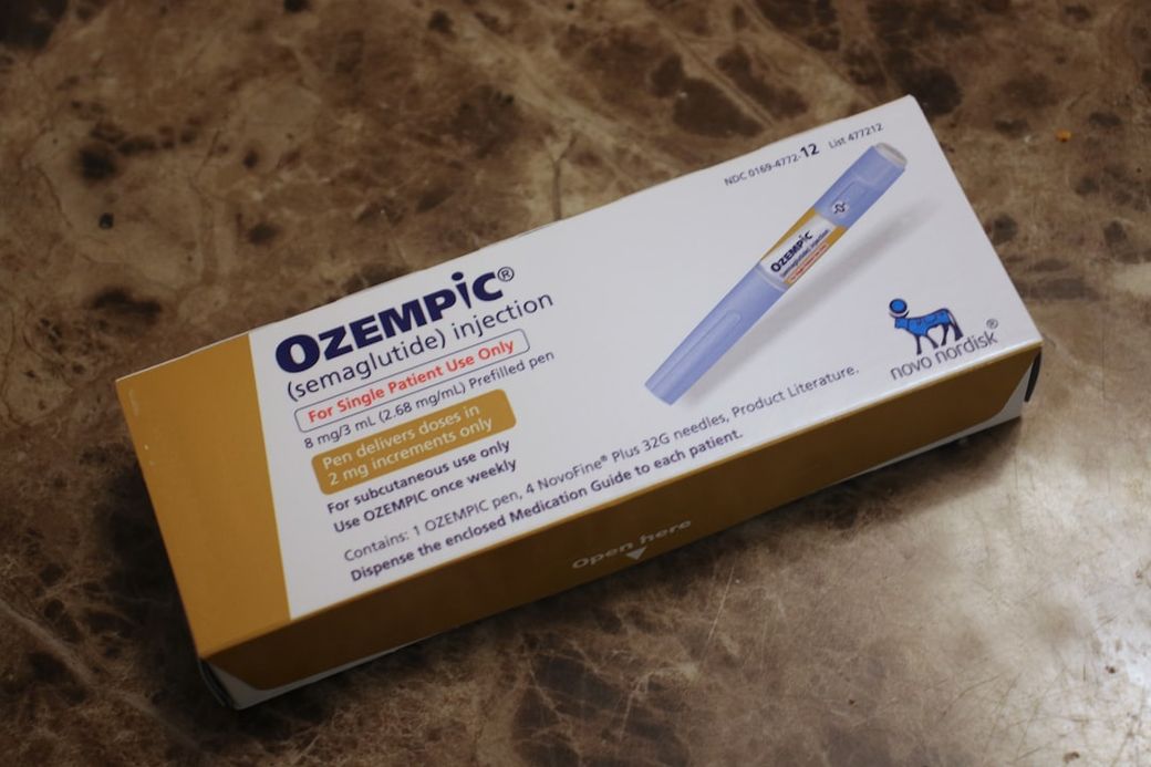 The image shows a package of Ozempic (semaglutide) injection, which is intended for single patient use only. The package includes information on dosage and proper usage for the medication. — Credit: Photo by David Trinks on Unsplash