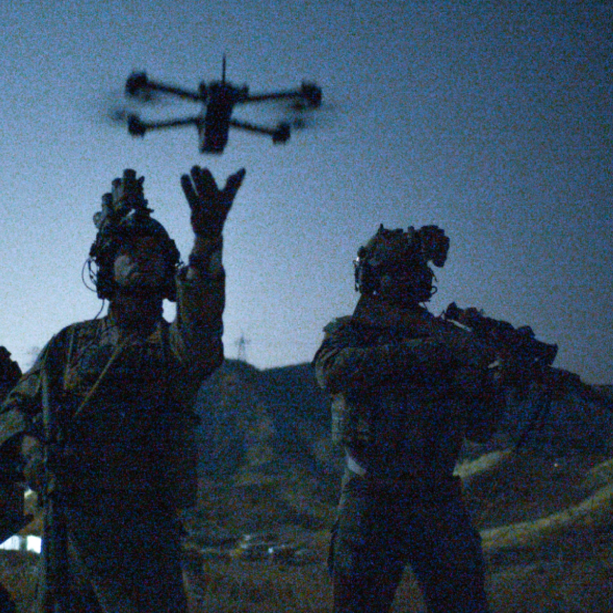 Soldier flying a Skydio ISR drone at night