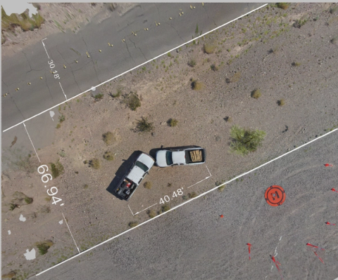 Taking measurements using a 2D model of a vehicle crash scene from above.