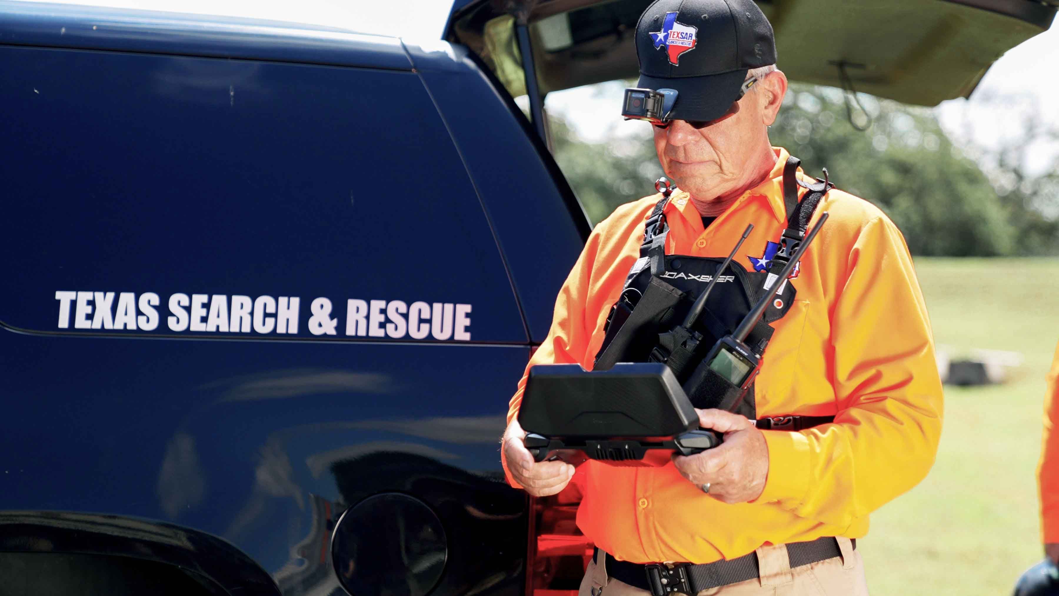 Search and Rescue member using a Skydio drone controller