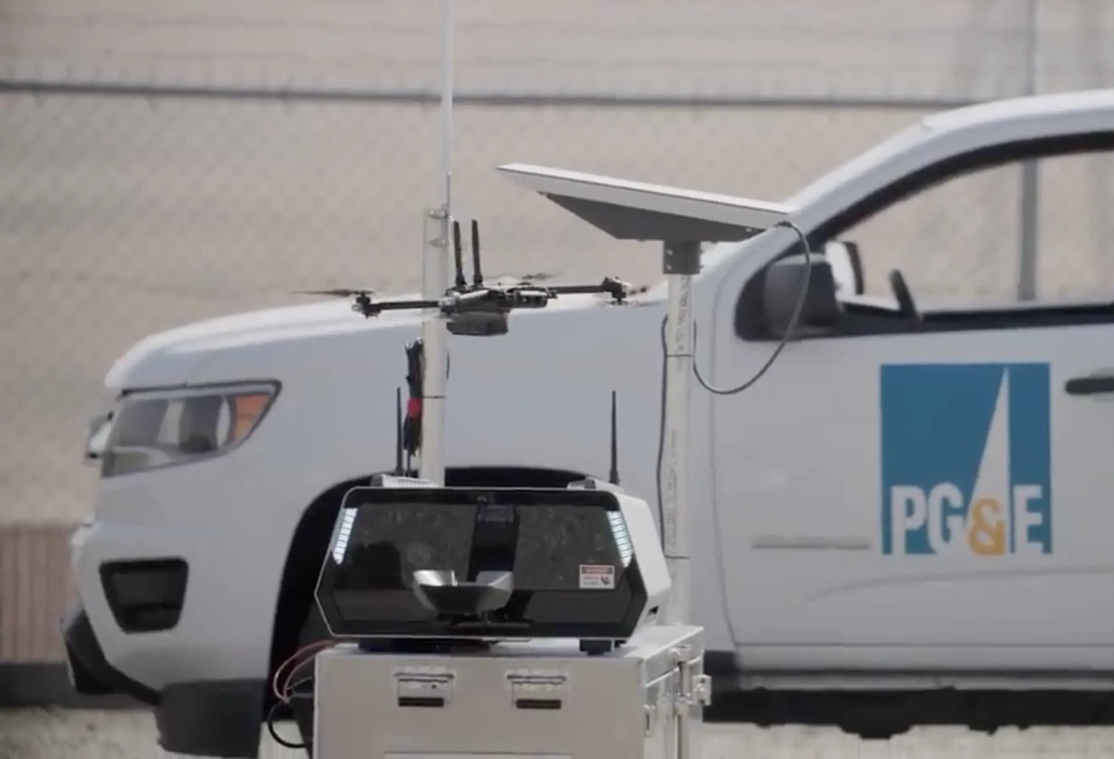 PGE truck in the background, foreground is a Skydio dock on top of a container.