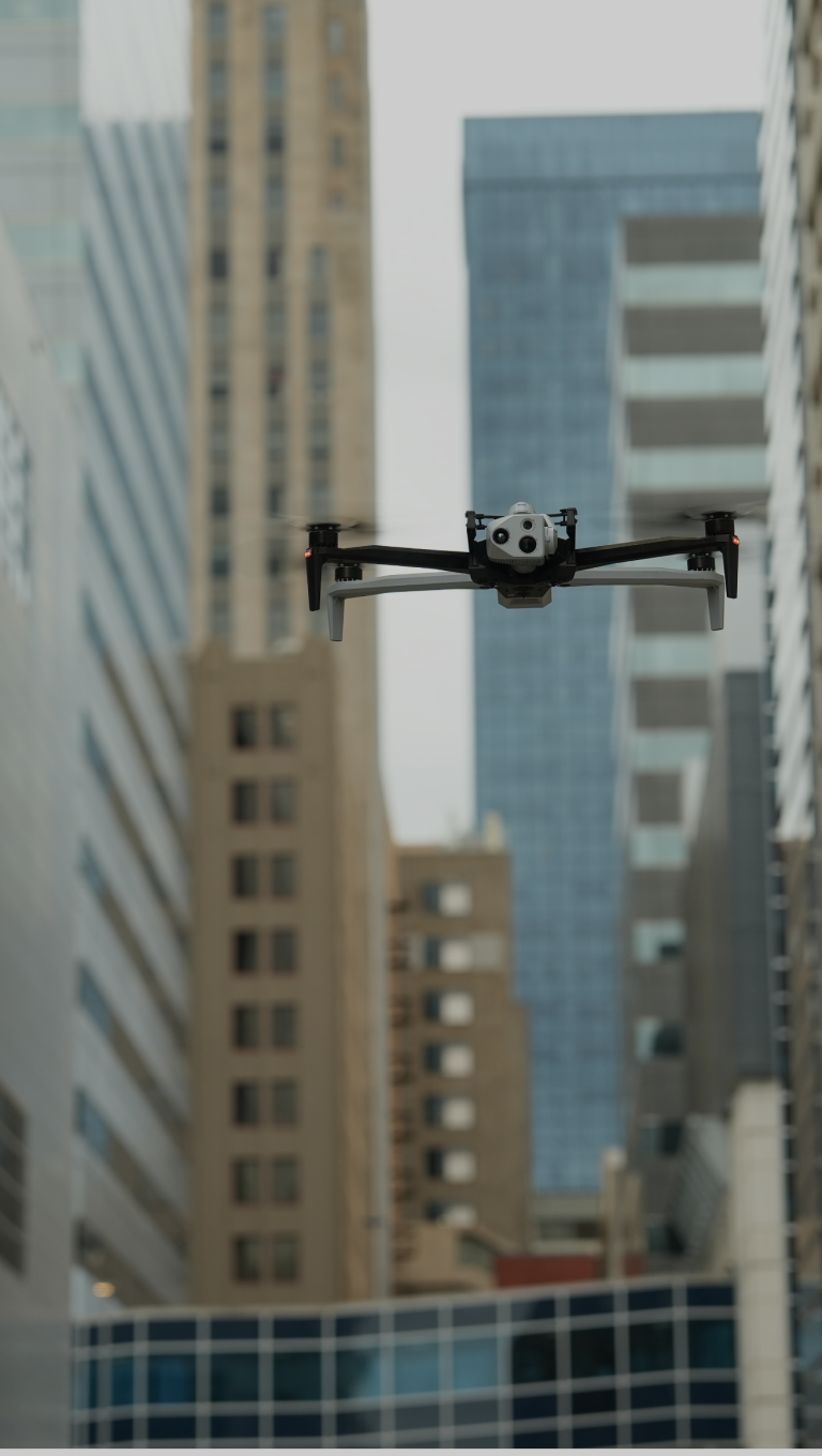 Skydio X10 Drone in flight in urban city portrait view