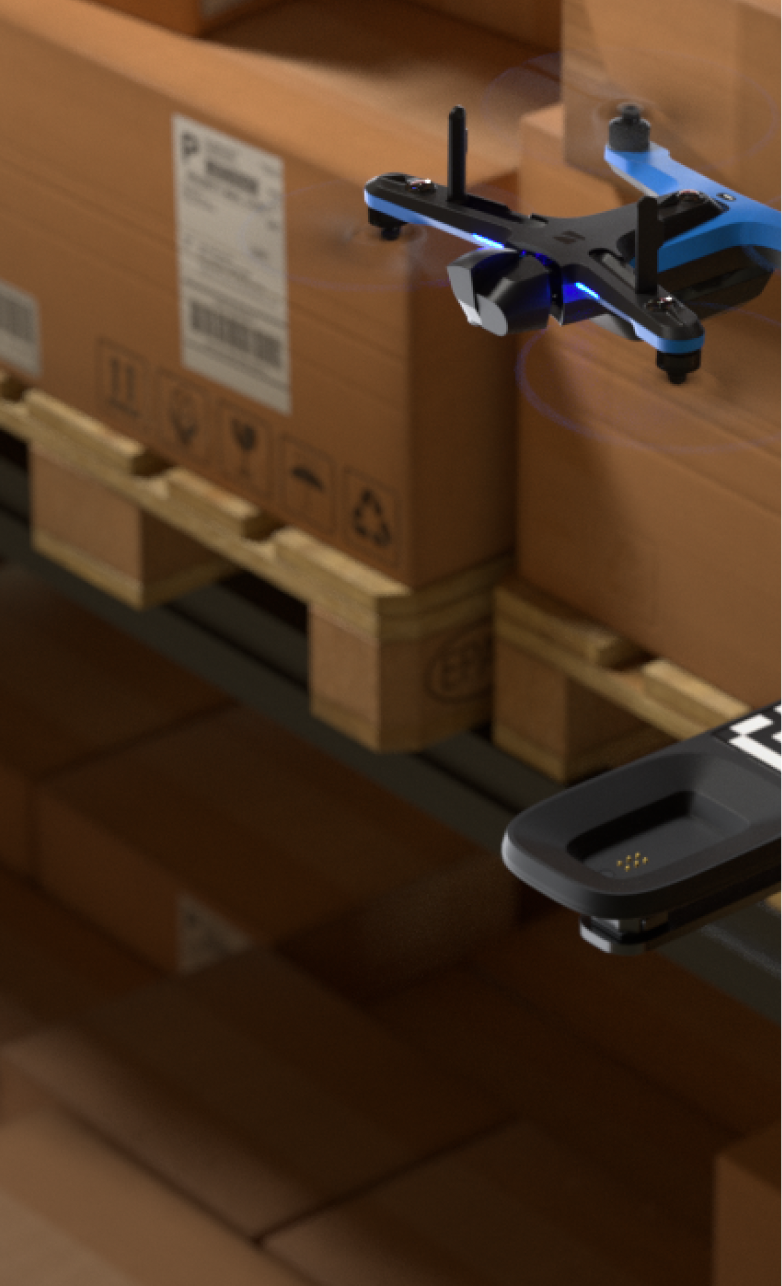 portrait view of Skydio drone leaving dock lite inside warehouse facility