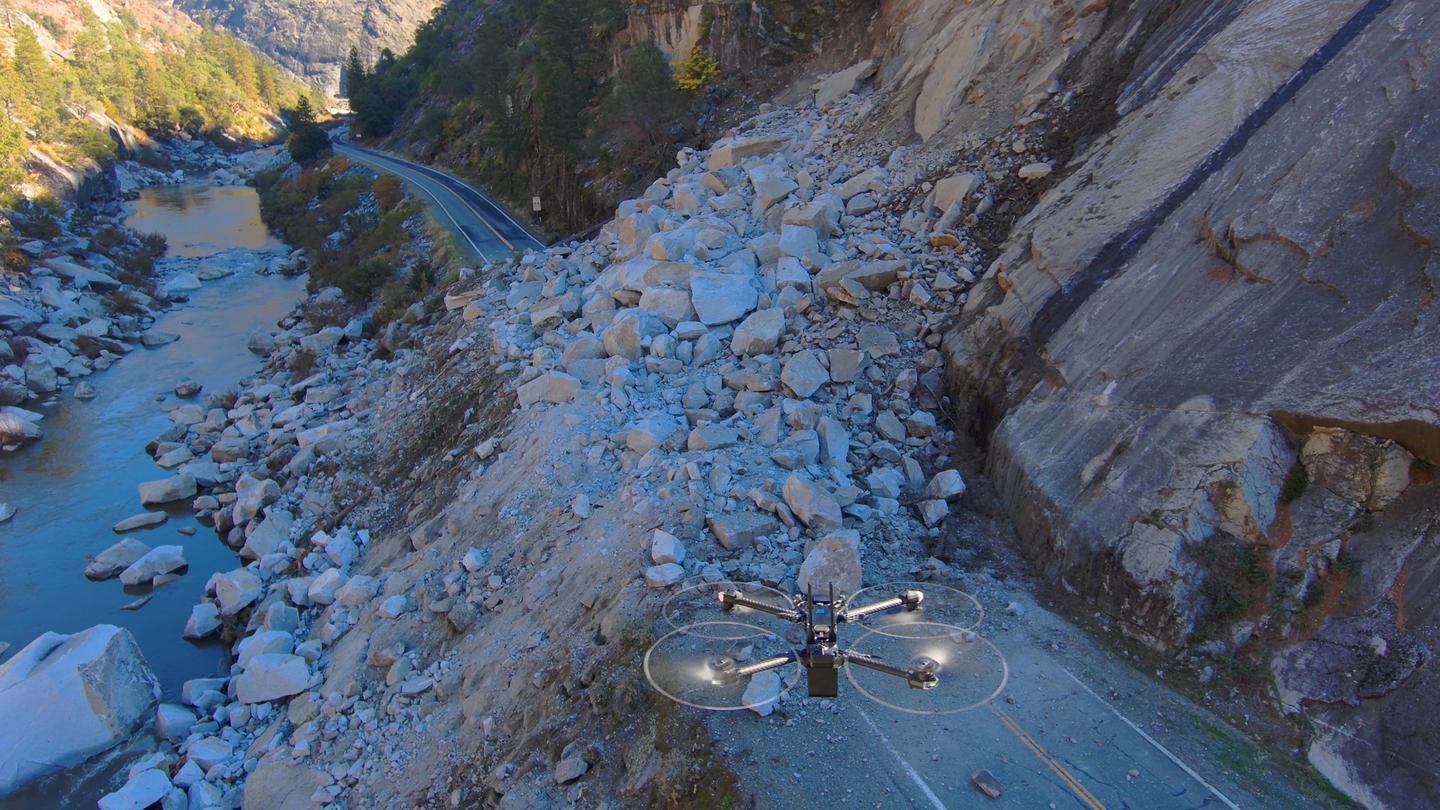 Skydio Drone approaches rubble over highway