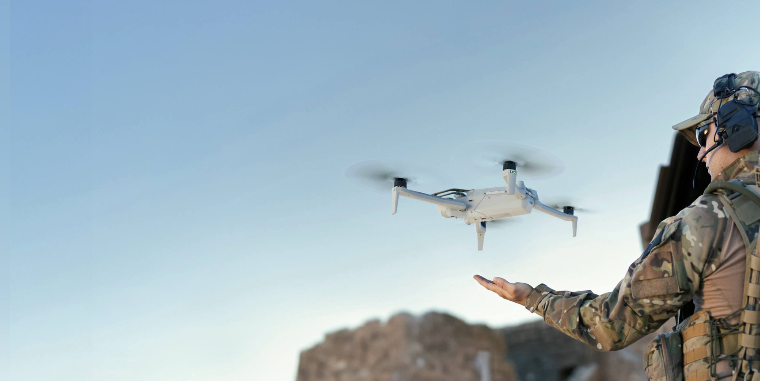 soldier releasing drone from hand
