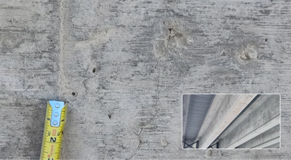 aerial photo of bridge with tiny crack. in concrete picked up by drone at a distance