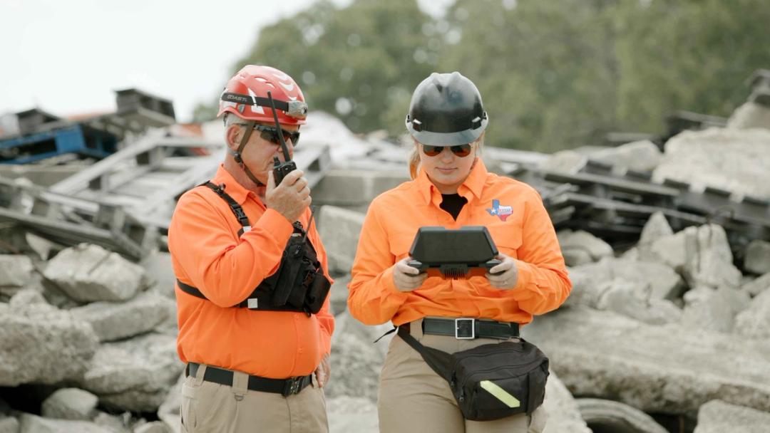 Search and rescue operators using a Skydio drone controller