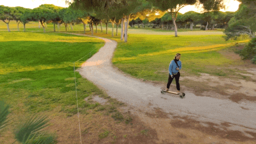 Skydio 2 tracking electric skateboader in trees