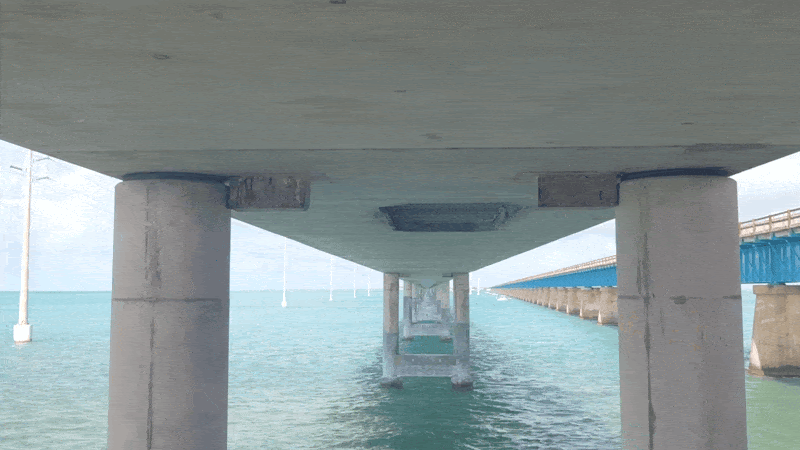Skydio X10 zooms in on details underneath a freeway over water in Florida.