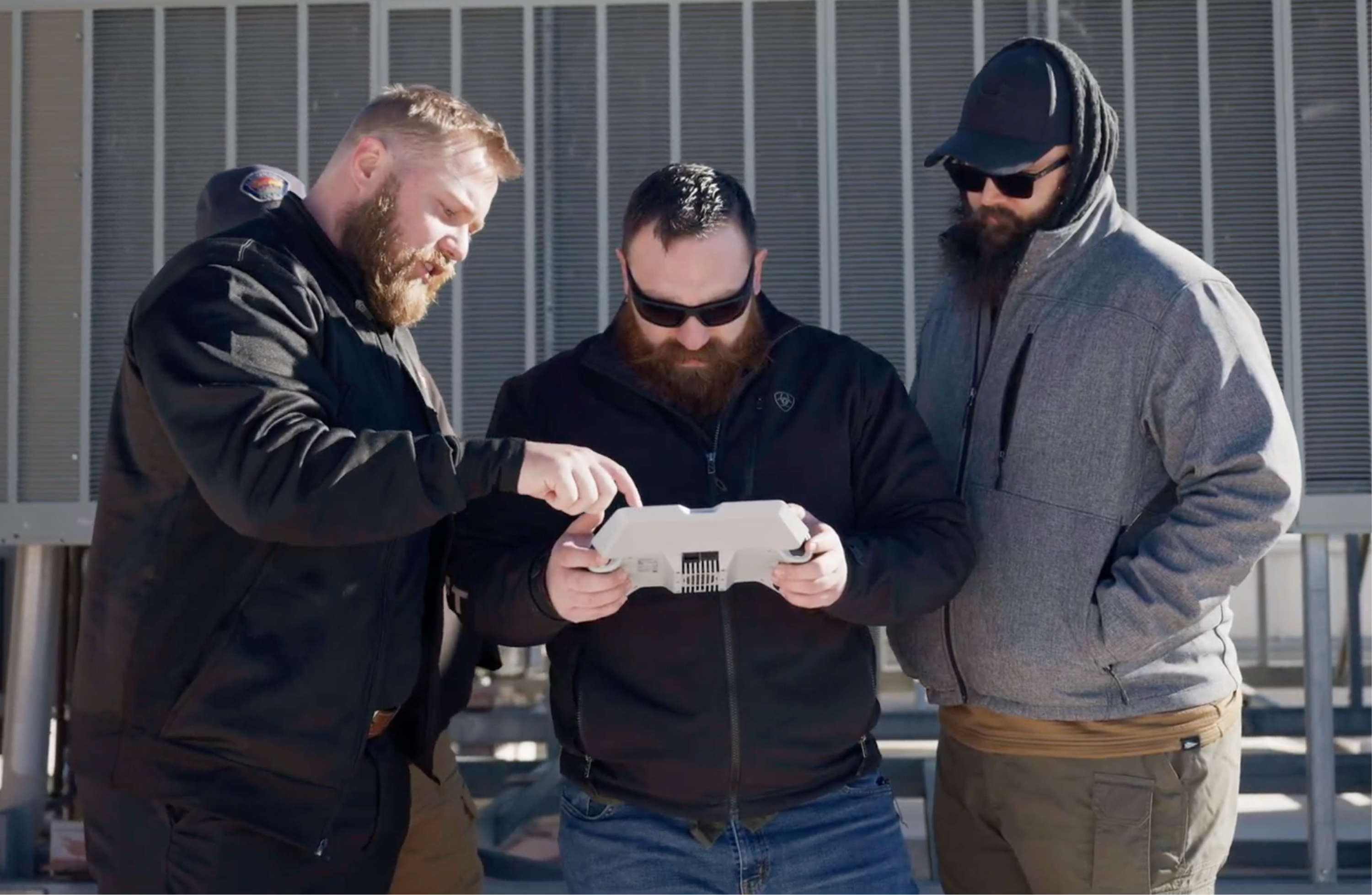 Success services team demonstrating customer on Skydio controller