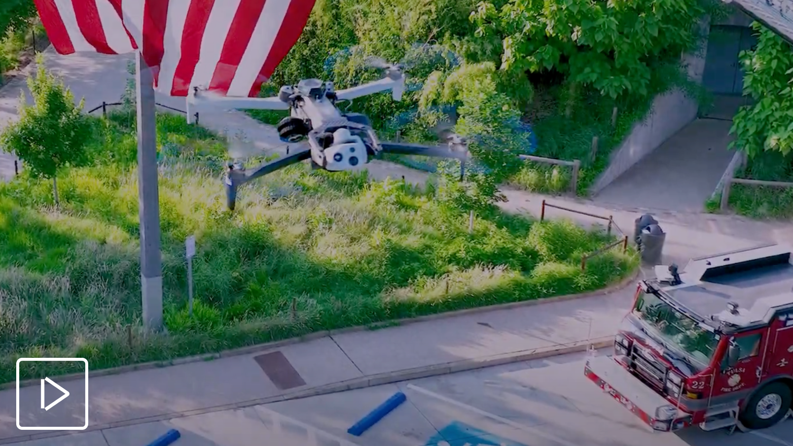 Skydio X10 drone in flight with US flag in background