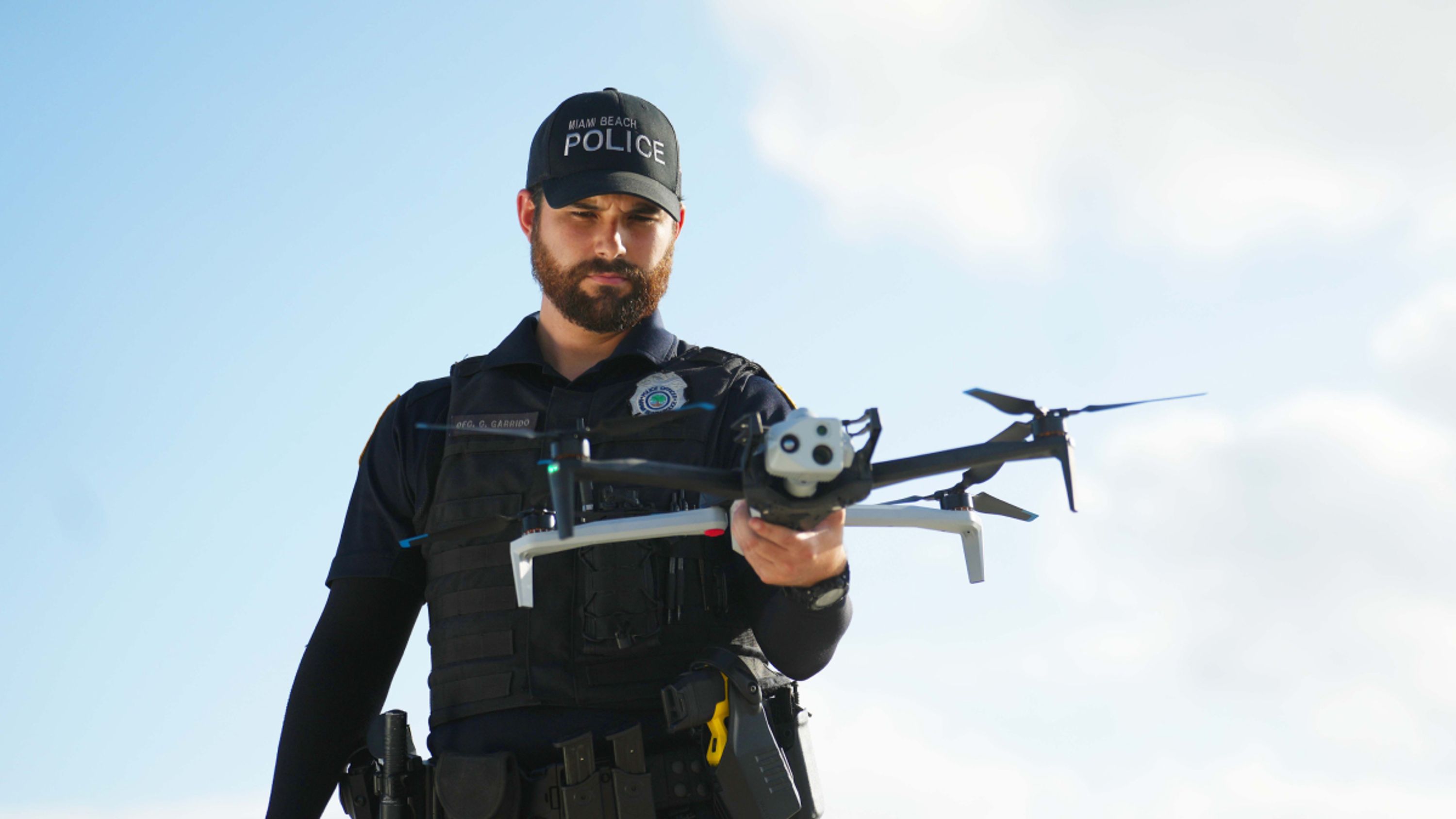 Miami Beach police officer with a Skydio X10 drone in hand