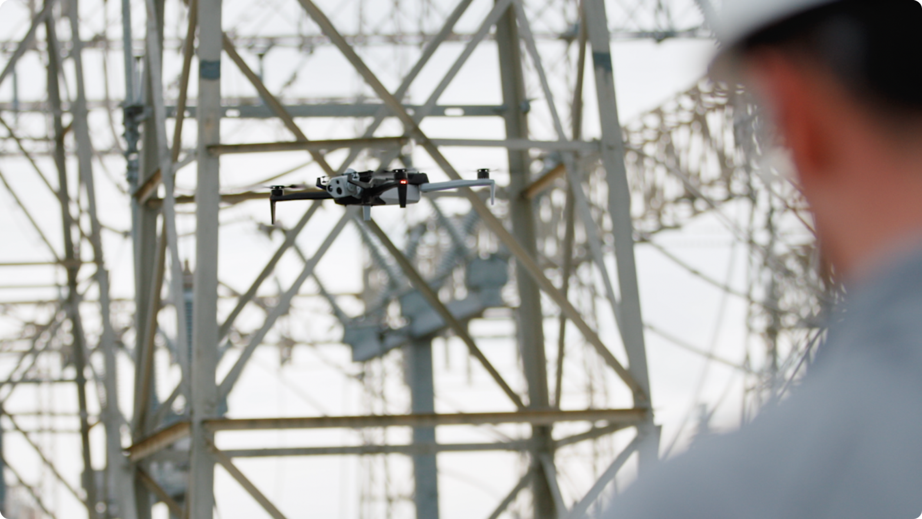Skydio X10 drone flying near utility power infrastructure