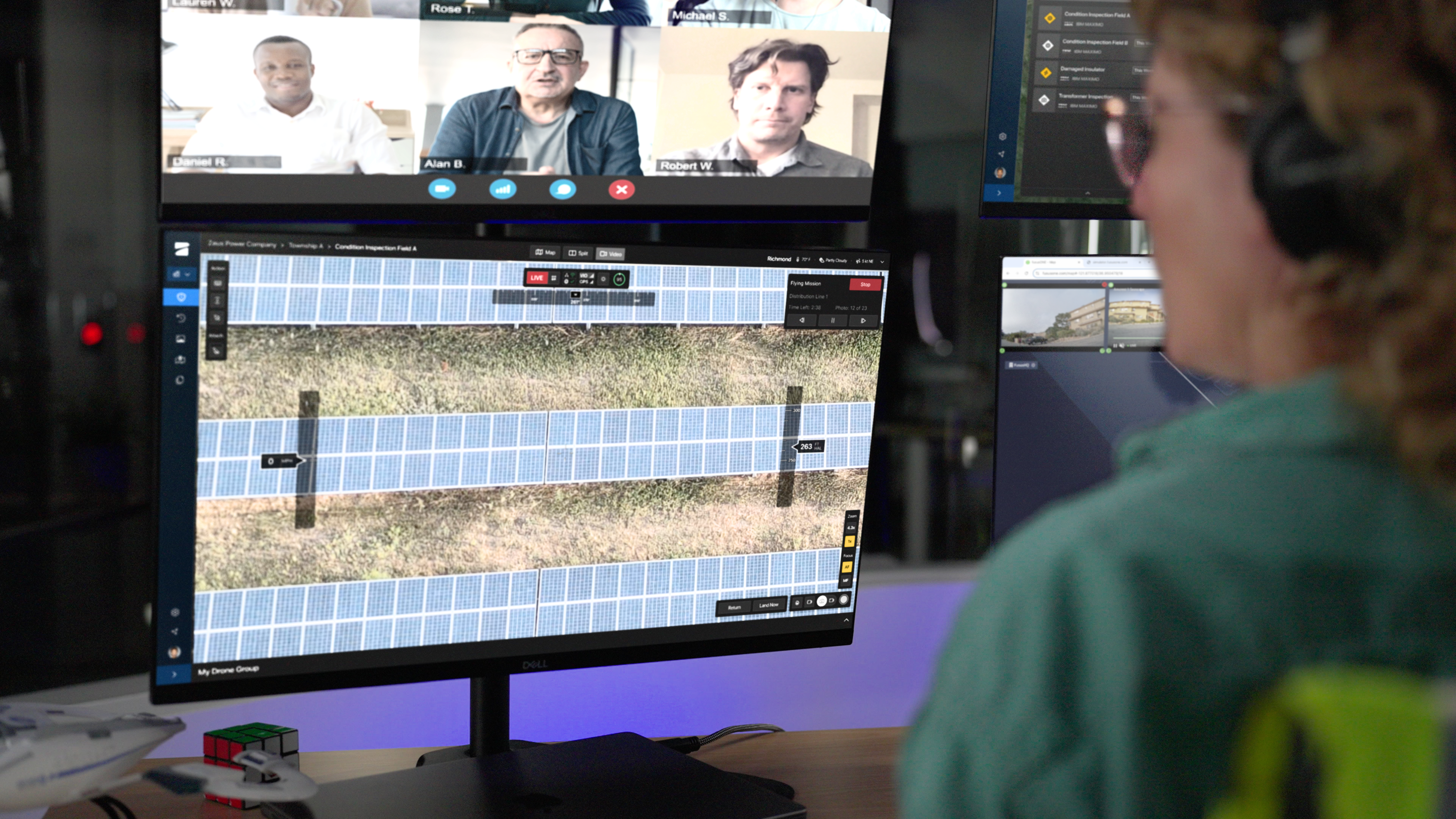 Command center streaming live view of drone perspective of mission and map view of mission on multiple screens