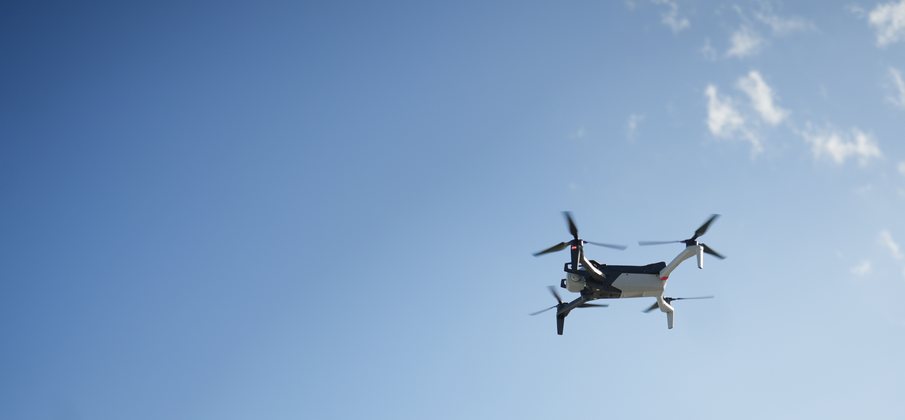 underside of Skydio X10 drone in flight