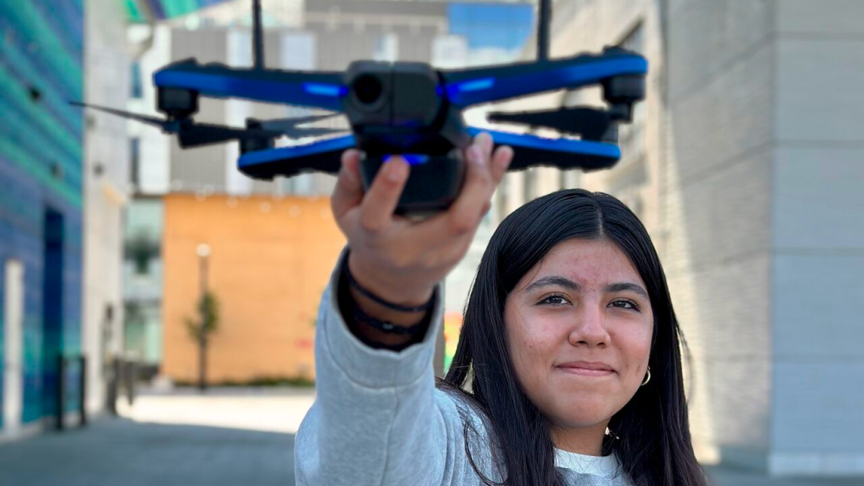 student holding a Skydio 2+ drone
