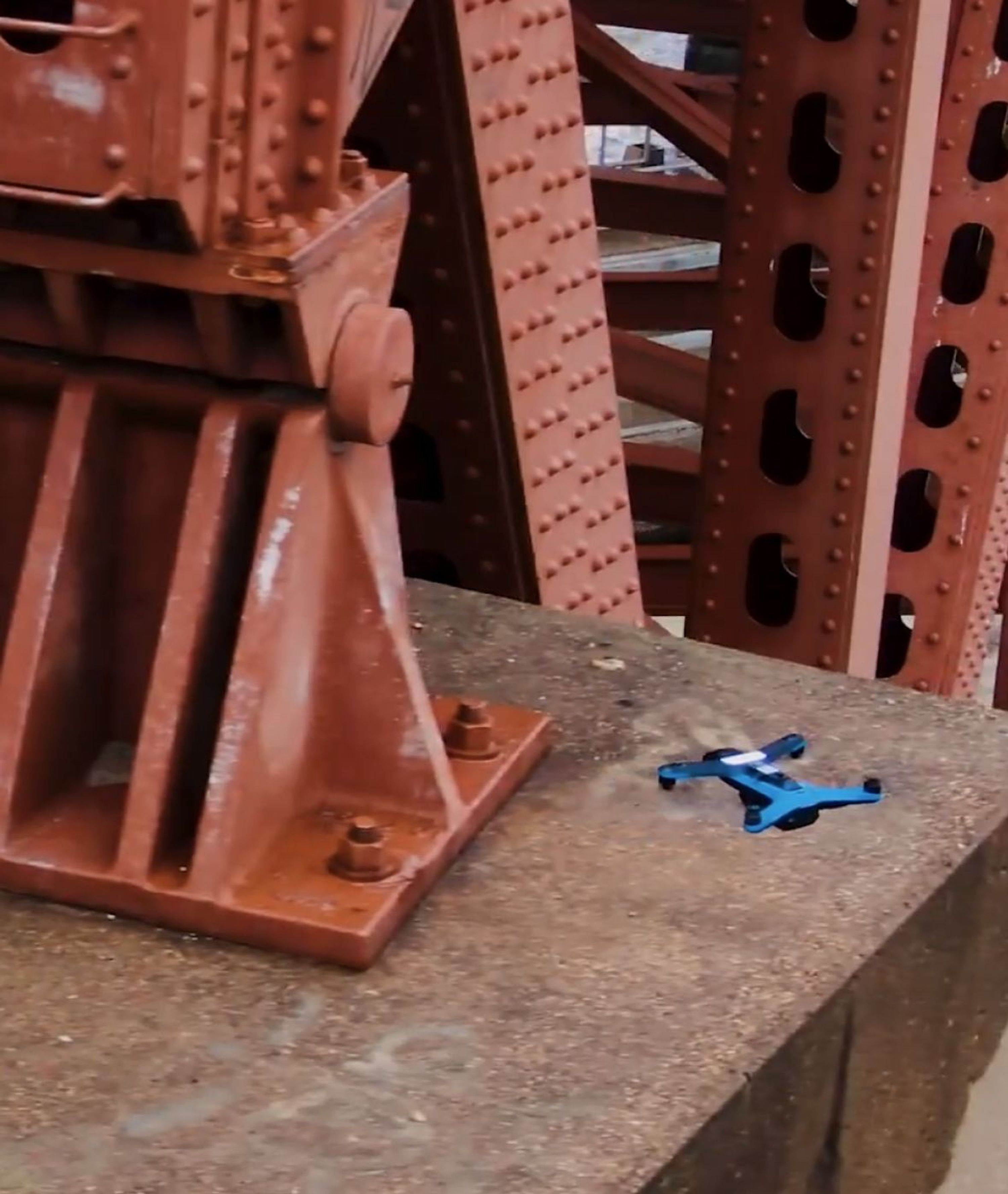 Skydio inspection drone near a bridge support