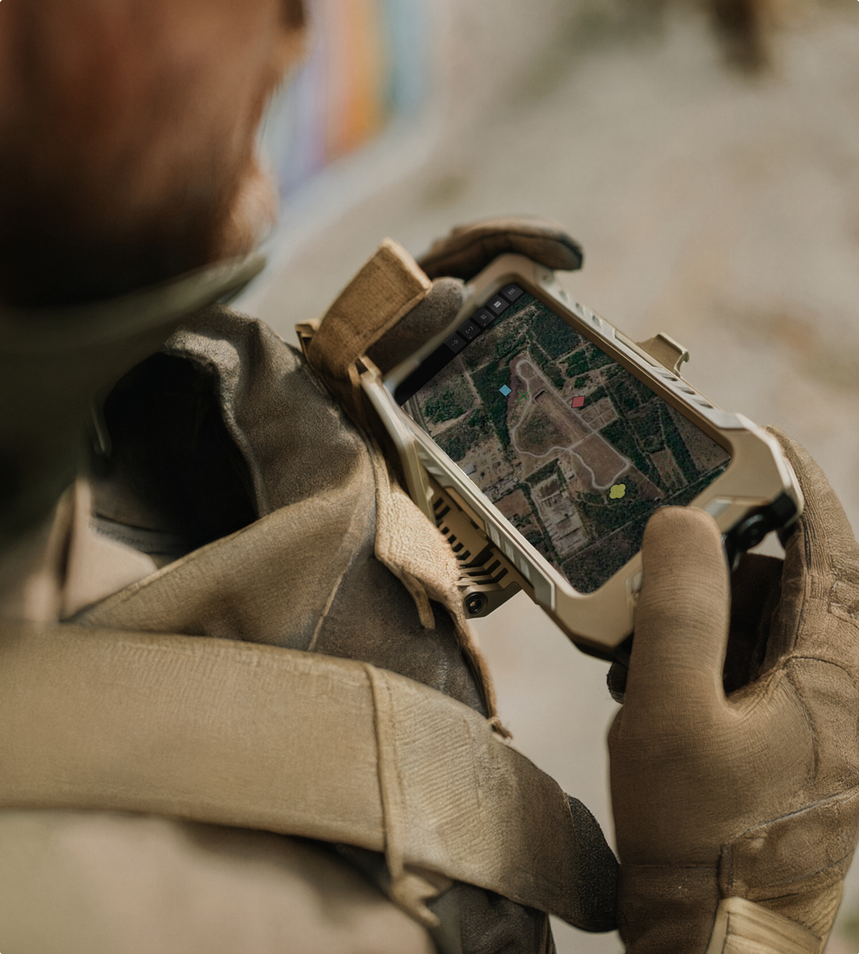 Soldier viewing TAK EUD with markers on map 