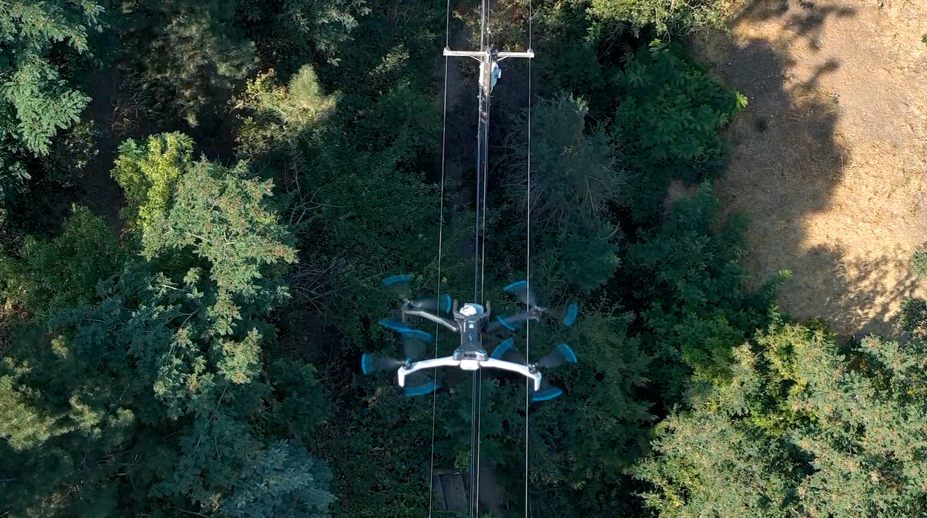 Skydio X10 inspecting a power line closely from above