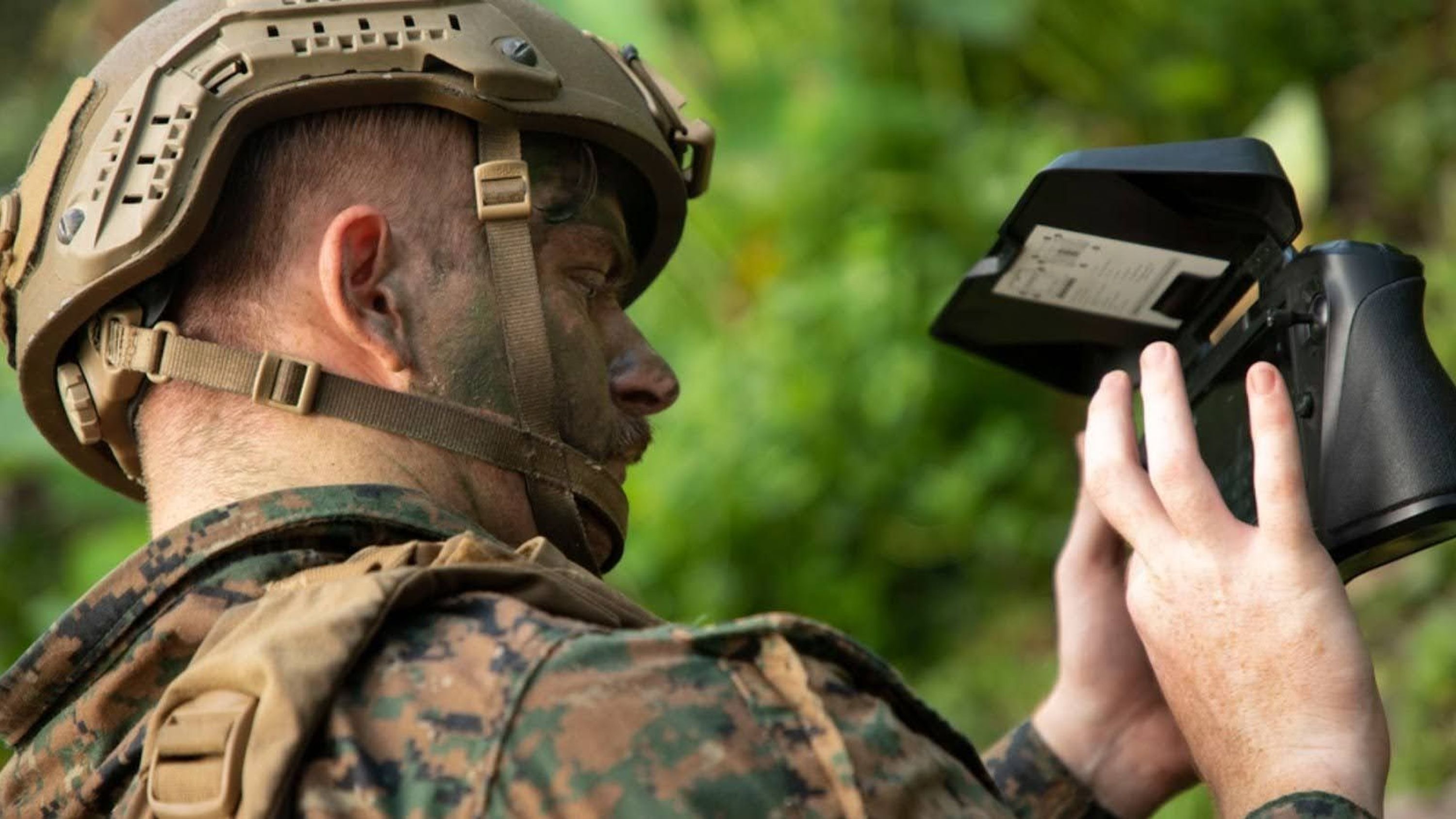 Warfighter with controller flying Skydio drone
