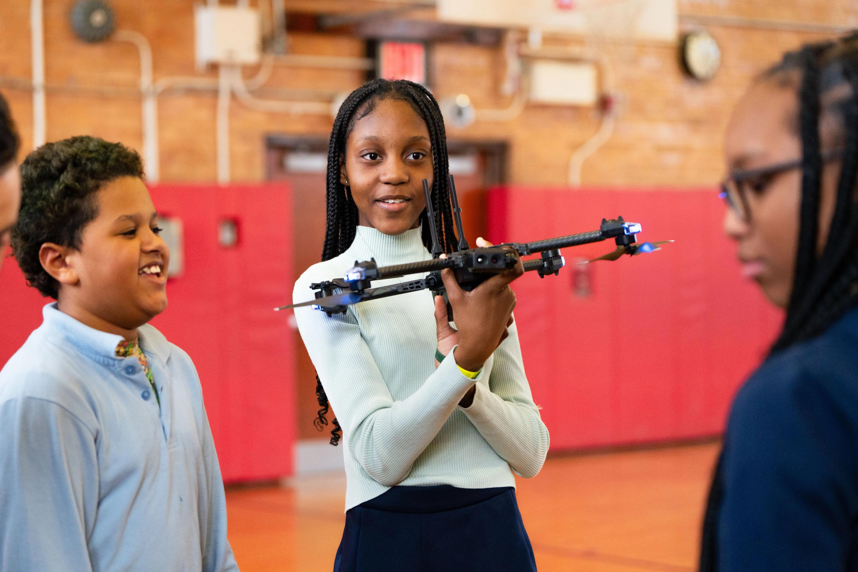 Student holding drone at Skydio Youth Fly Day presented by Skydio for All