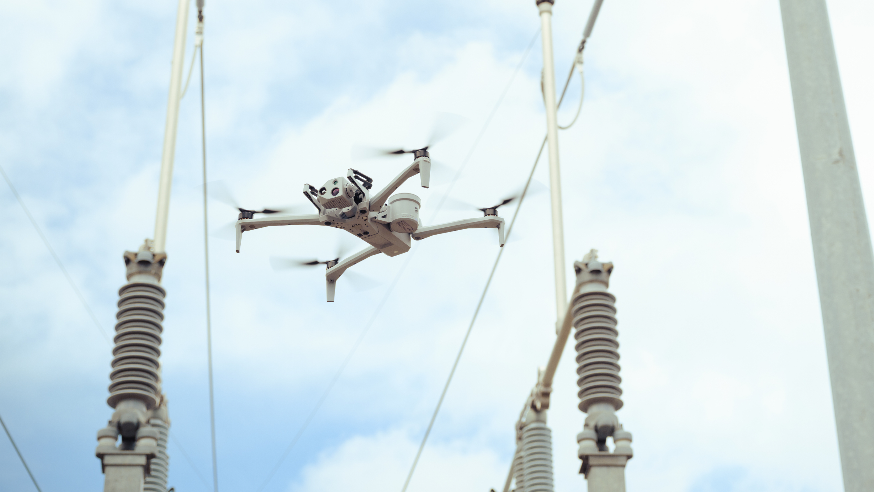Skydio x10 drone inspecting insulator connection in a utilities substation