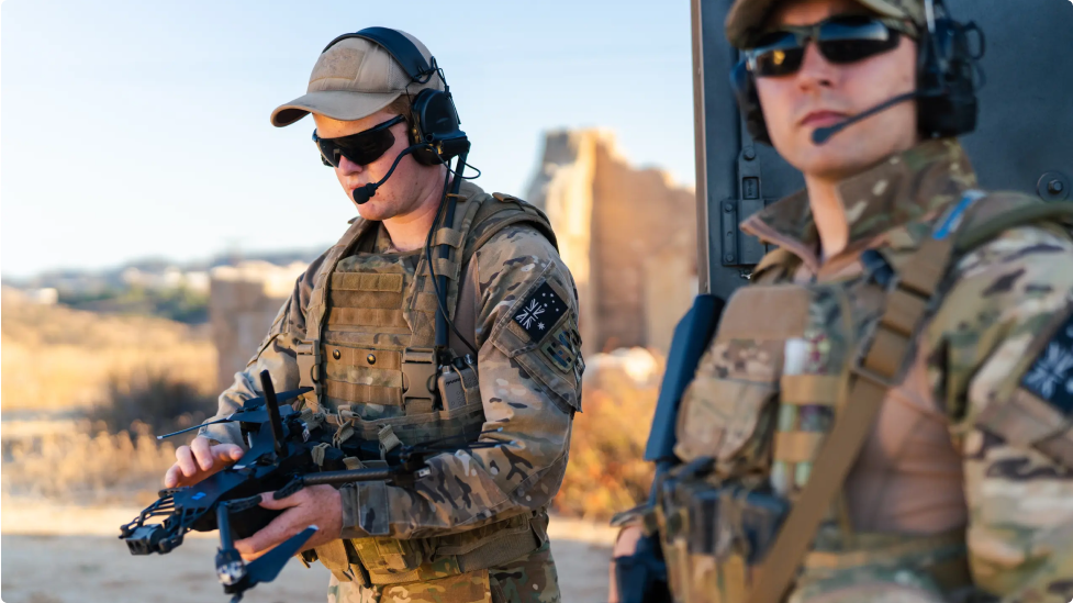 two warfighters with Skydio drone