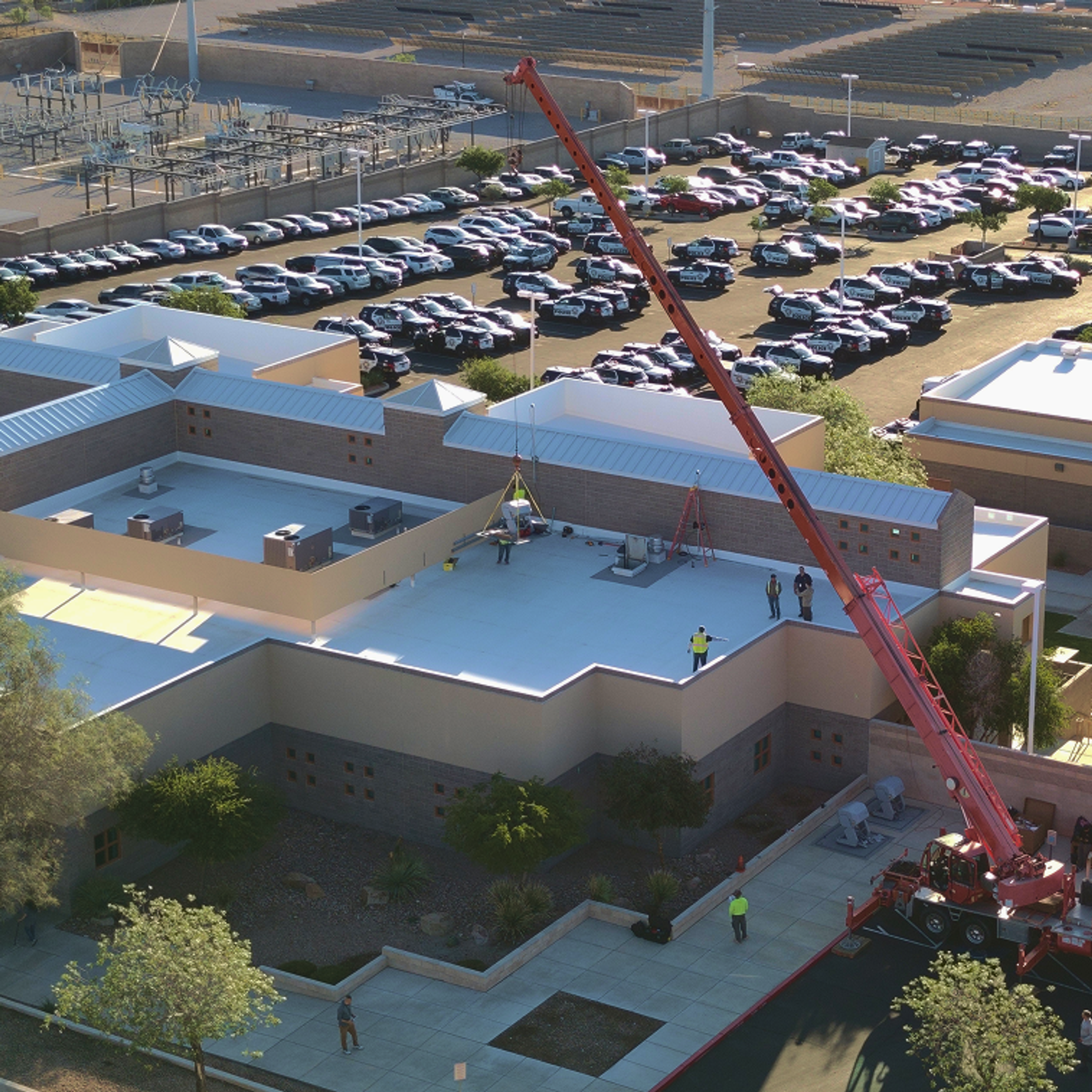 Skydio Dock being installed, crane hoisting it up to rooftop