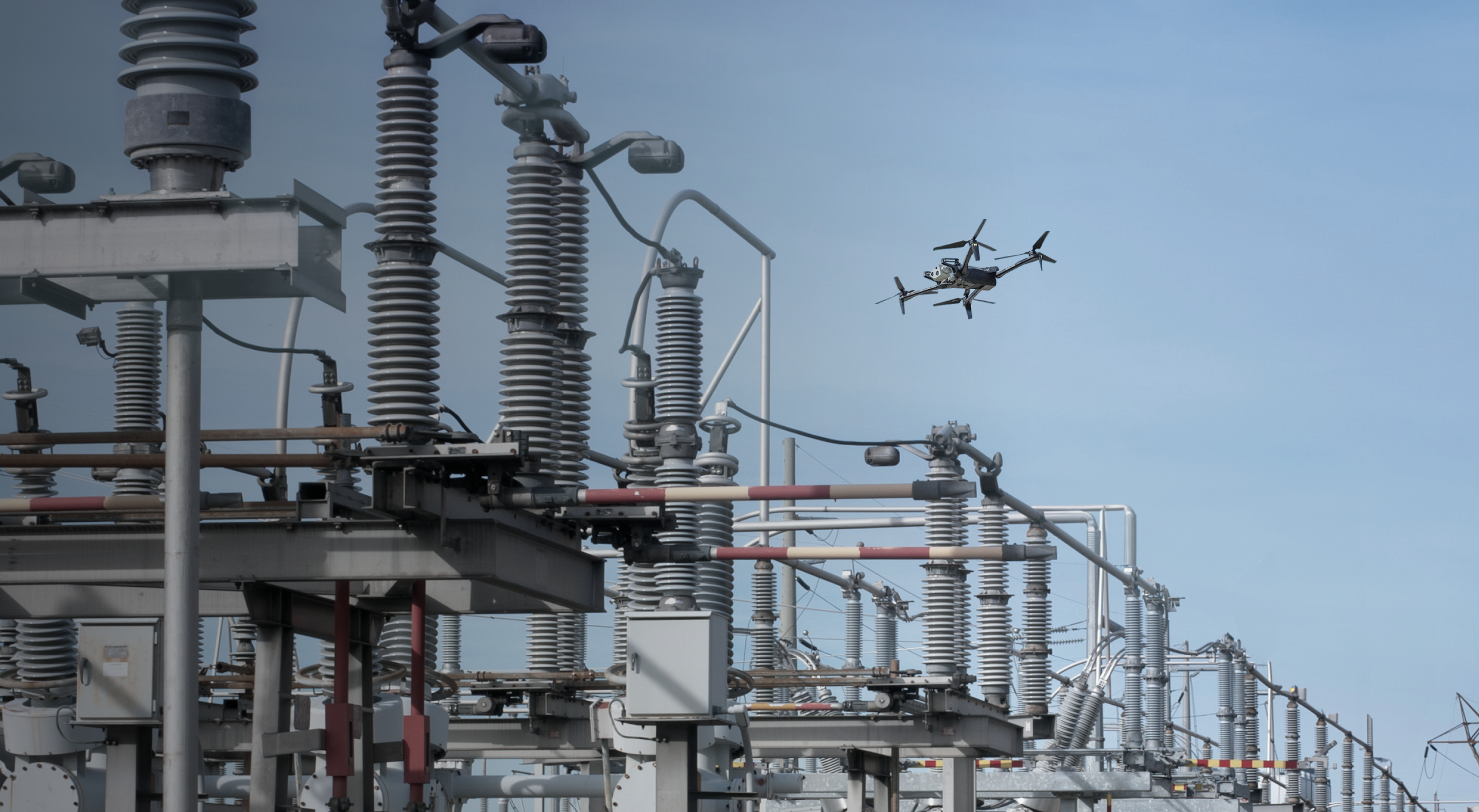 Skydio X10 drone flying over a transformer