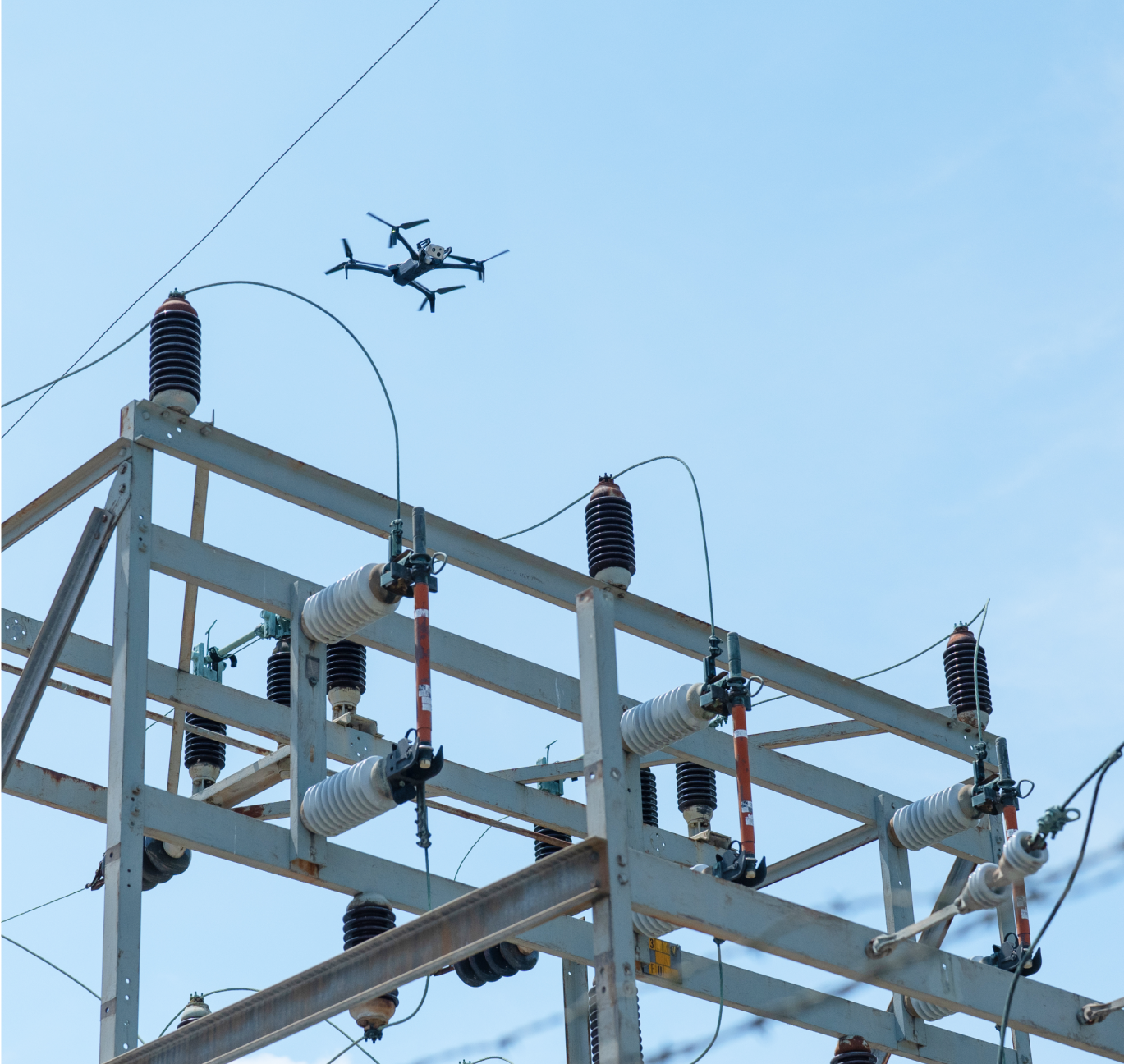 Skydio X10 utility inspection drone flying above a utility substration