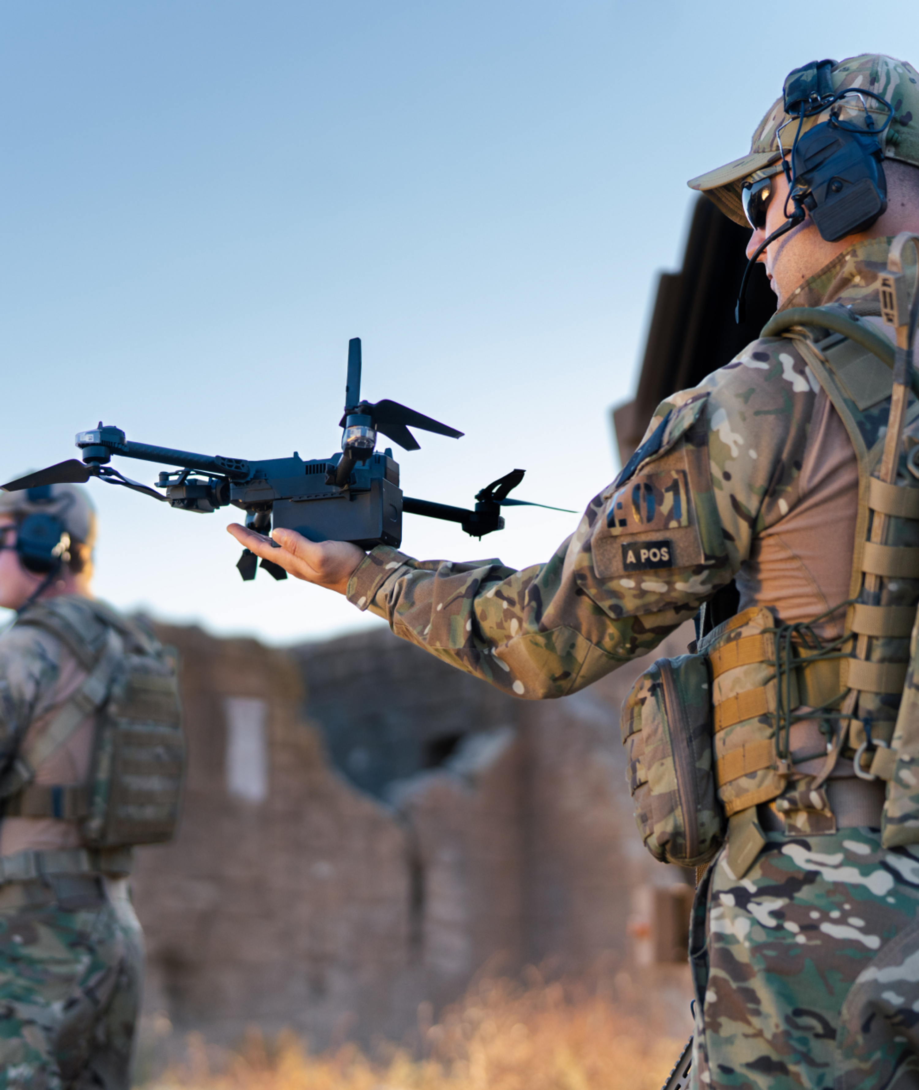 Skydio sUAS on a soldier's hand with others in the background