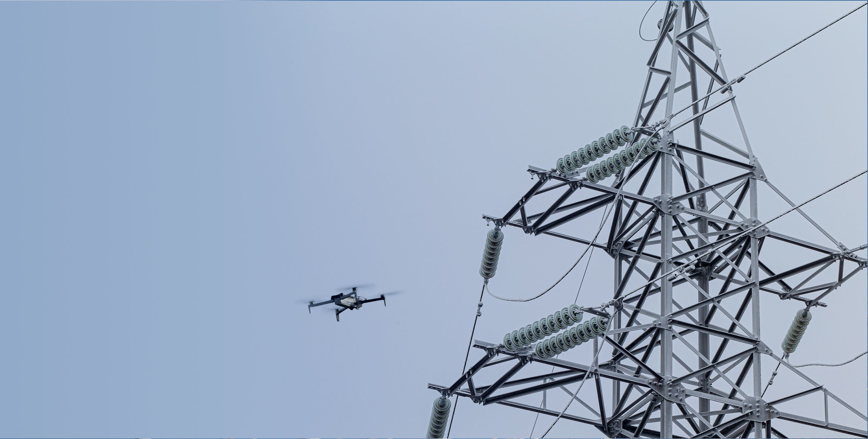Skydio X10 drone flying over power lines