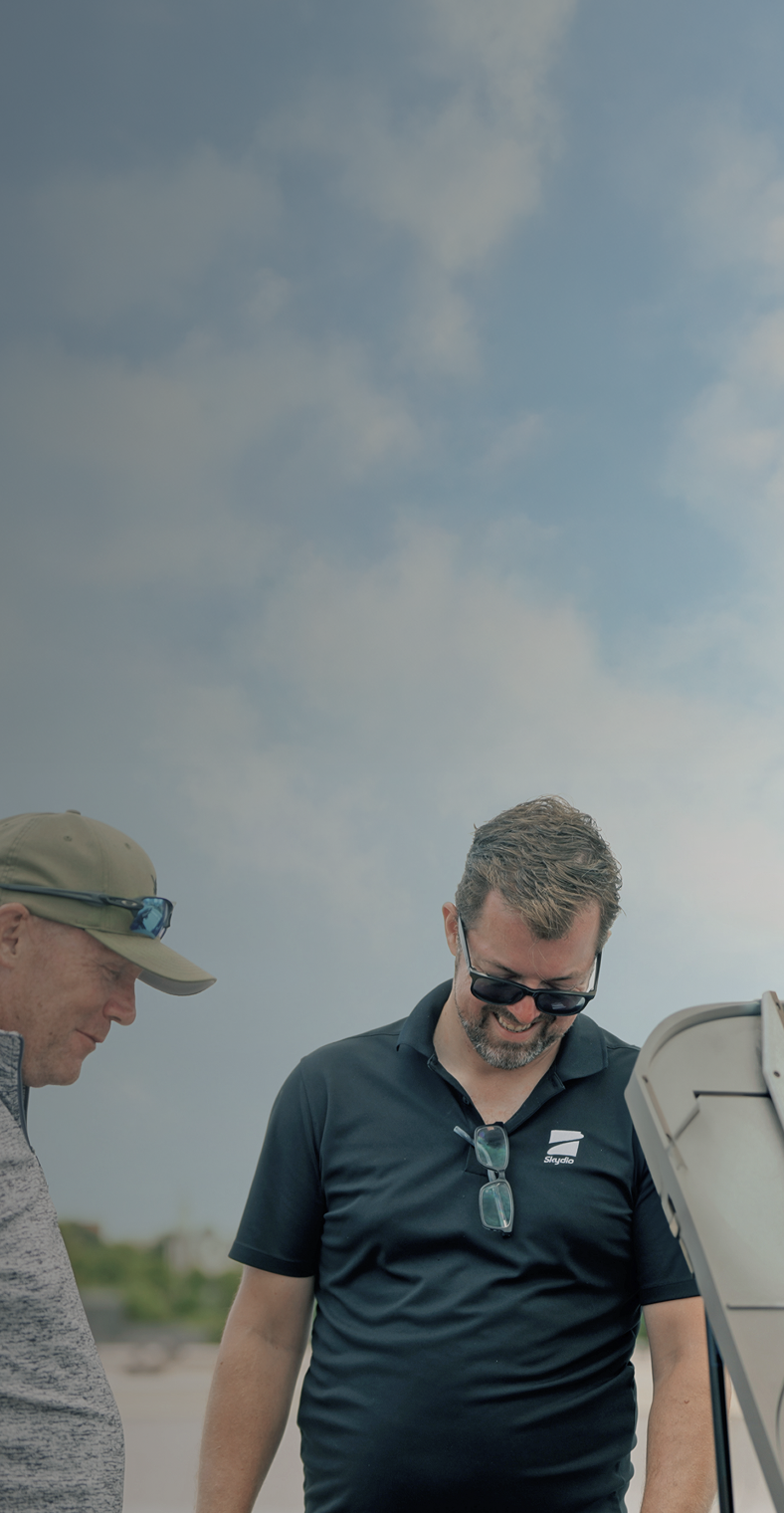 skydio personnel smiling looking down