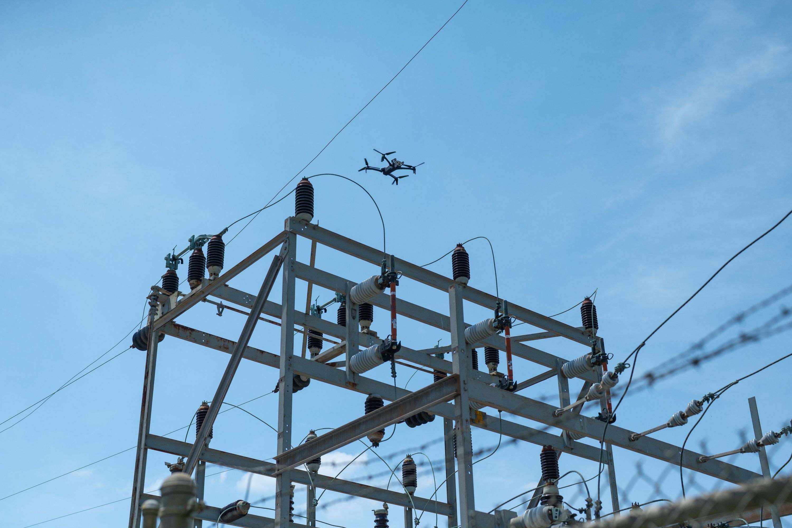 Skydio X10 inspection drone flying over utility assets