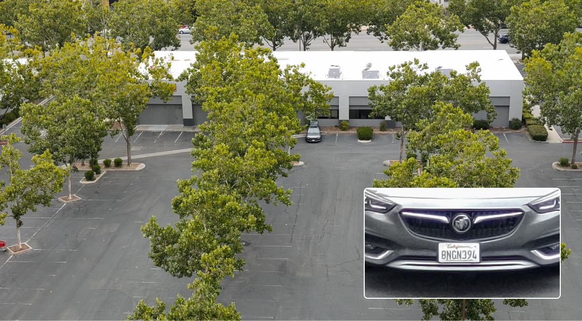 Skydio drone captured image of a parking lot with a zoomed in photo of a license plate