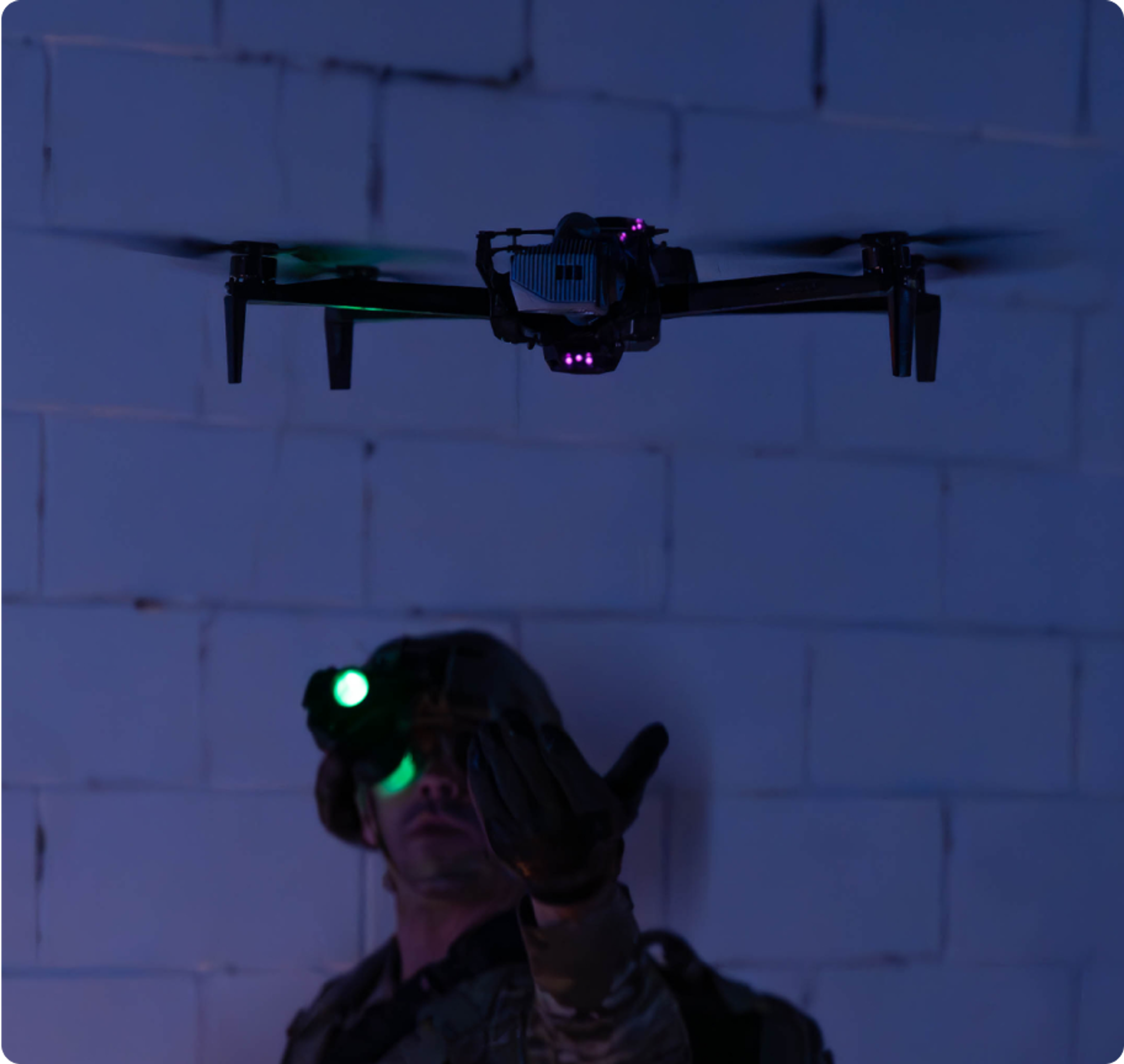 Soldier hand launching Skydio X10D at night 