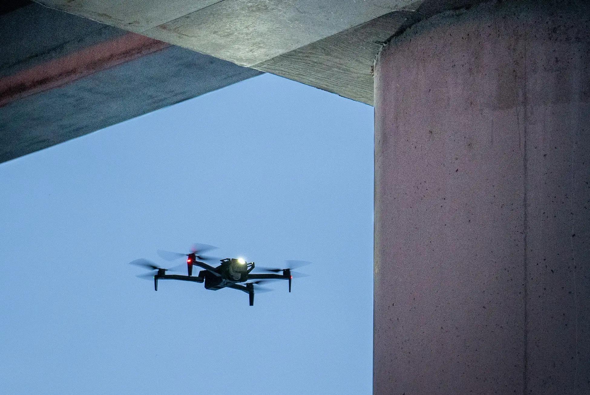 Skydio X10 inspecting concrete pillar of bridge