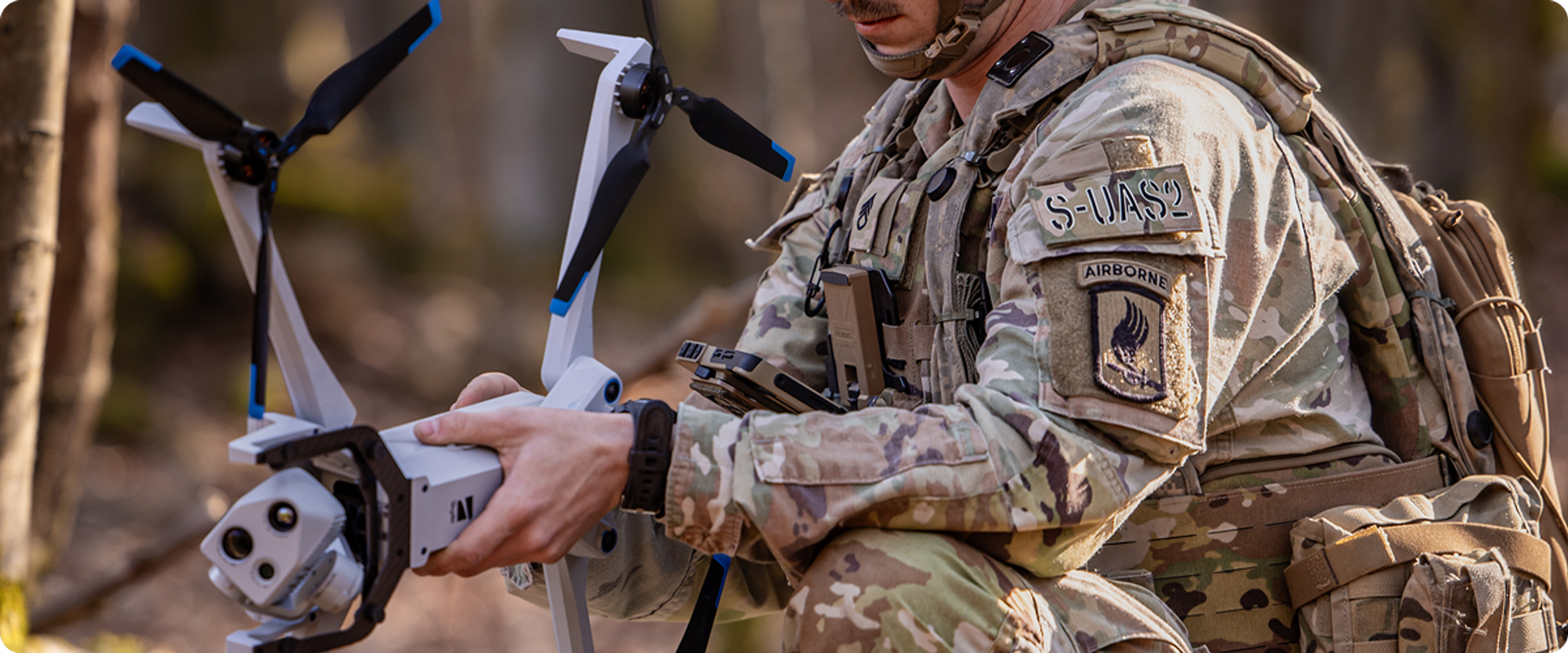 Military member unfolding Skydio X10D out in the field to use for reconnaissance 