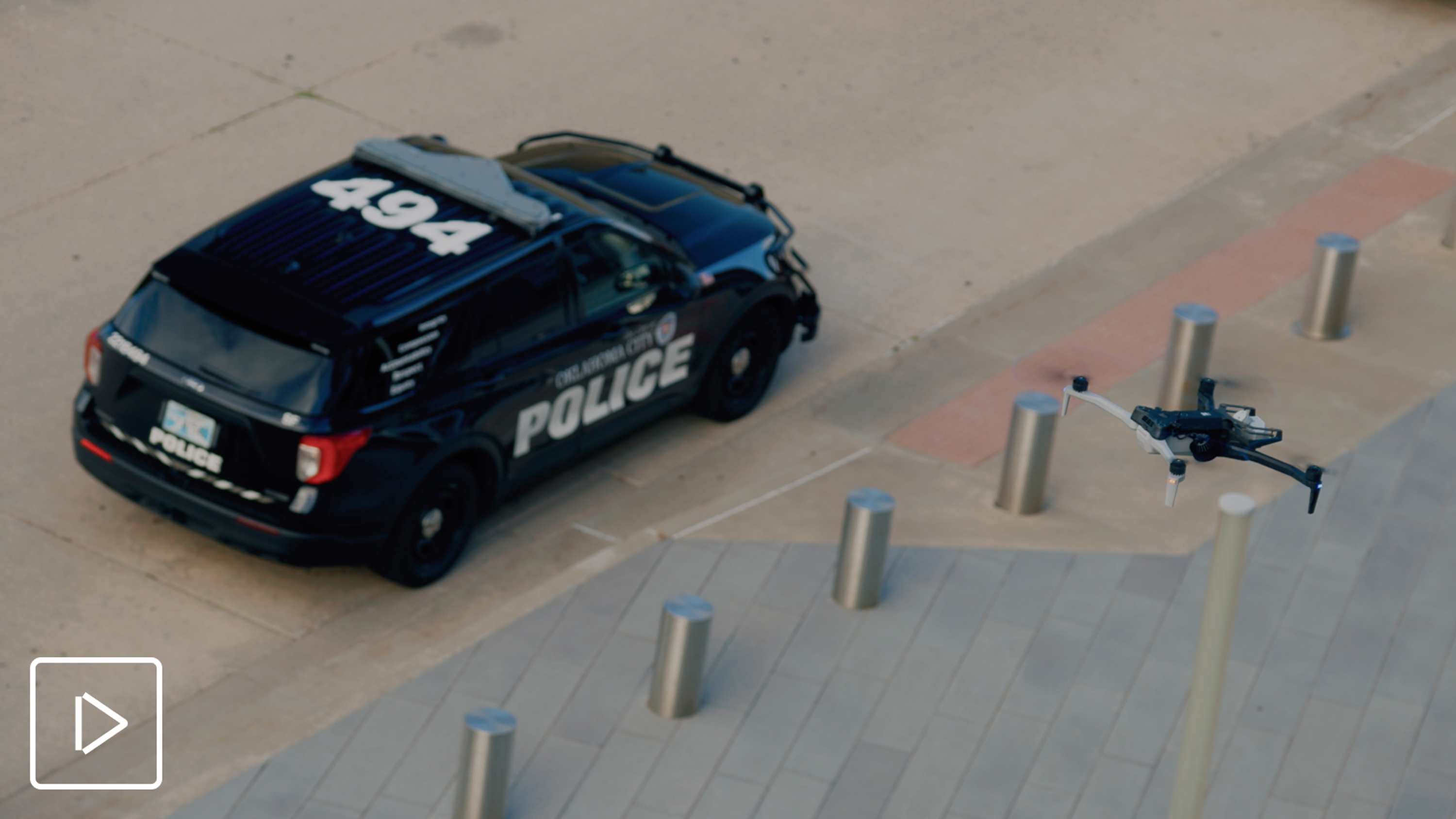 Skydio X10 law enforcement drone flying above a police vehicle