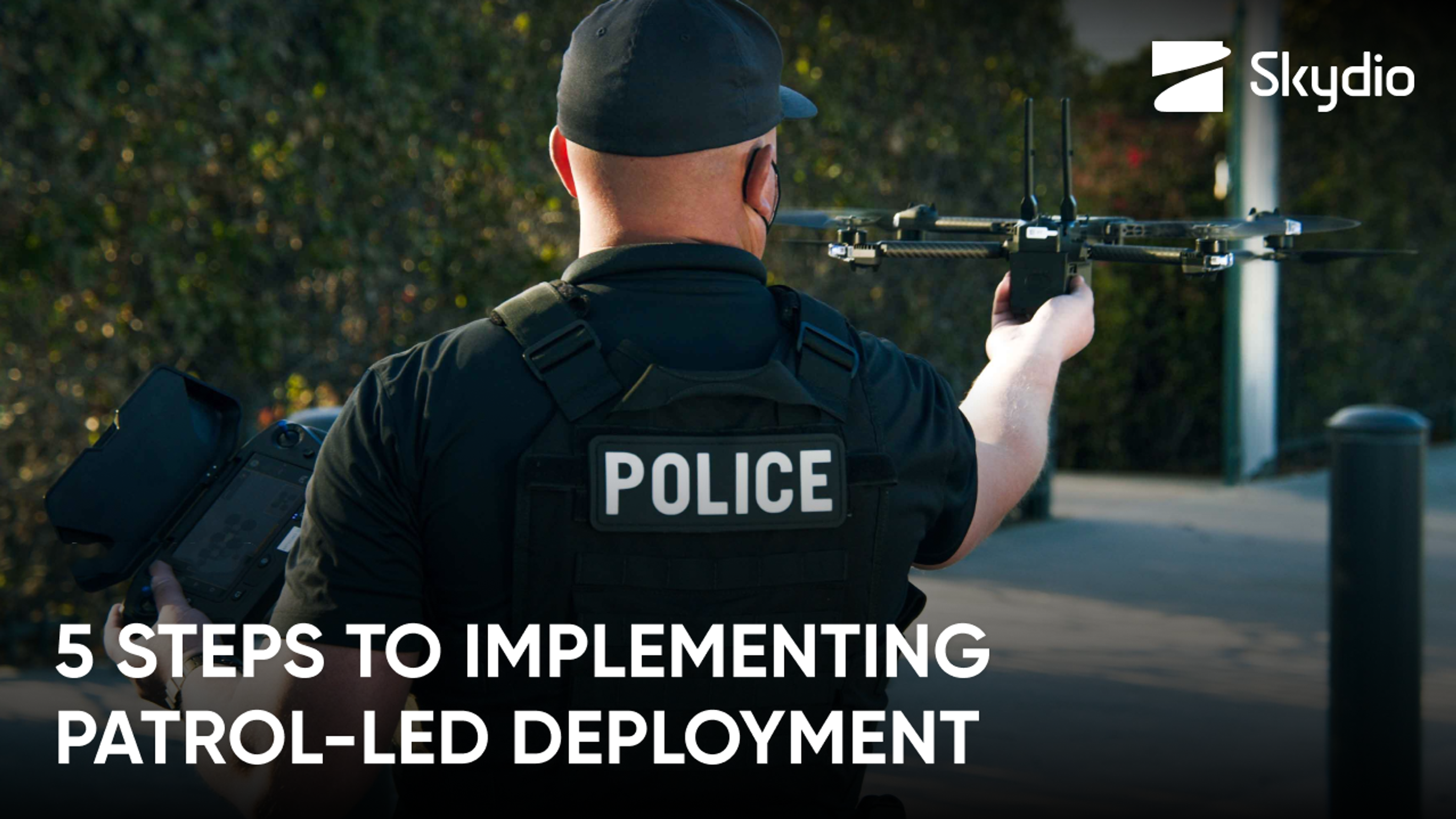 police officer with Skydio police drone in hand promoting 5 steps to patrol-lead drone deployment