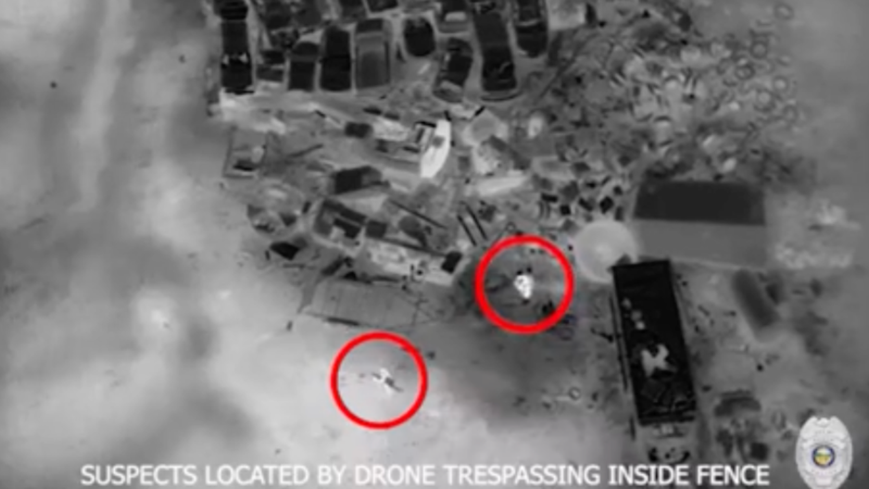 image from Skydio drone showing suspects inside a fence