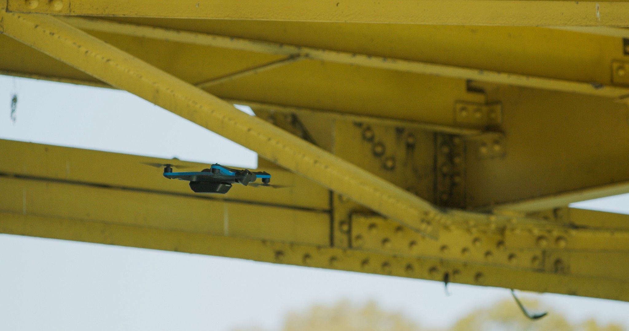 Skydio inspection drone at underside of the bridge