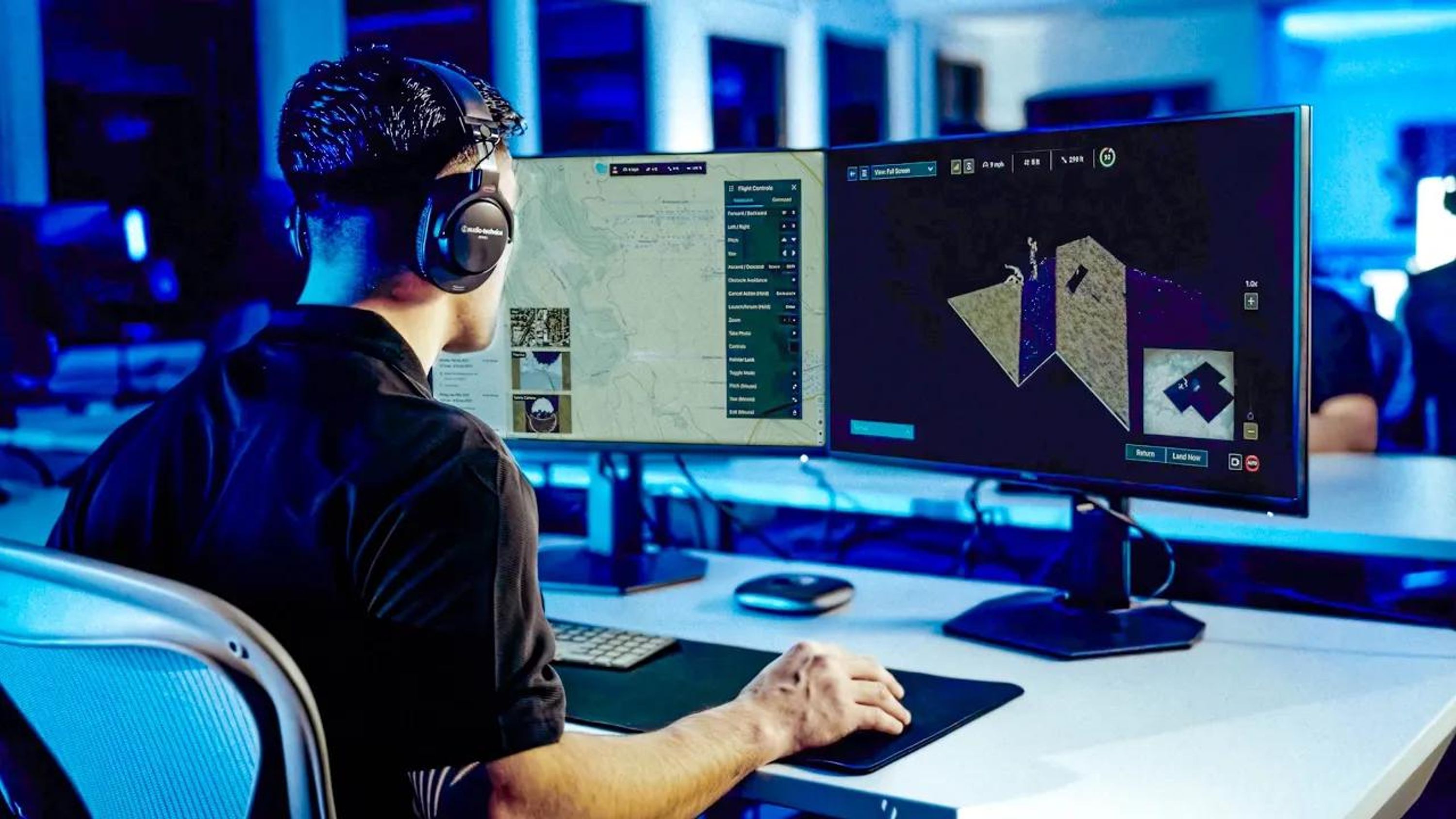 a man viewing a monitor to fly a Skydio drone remotely from a browser