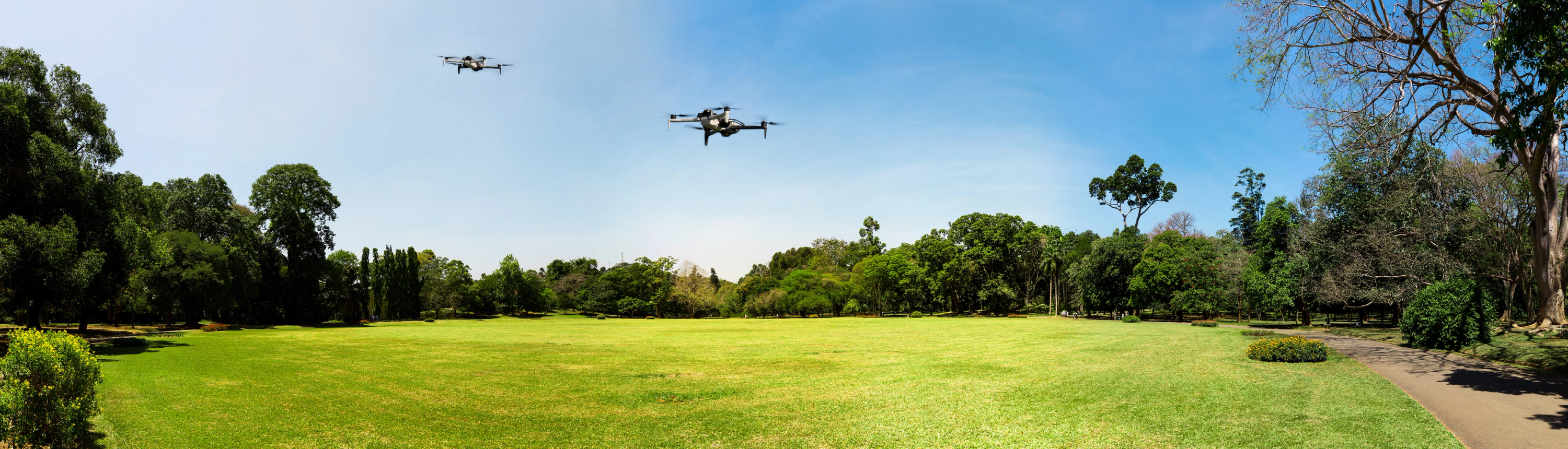 Skydio X10 autonomous drone in flight over grassy field