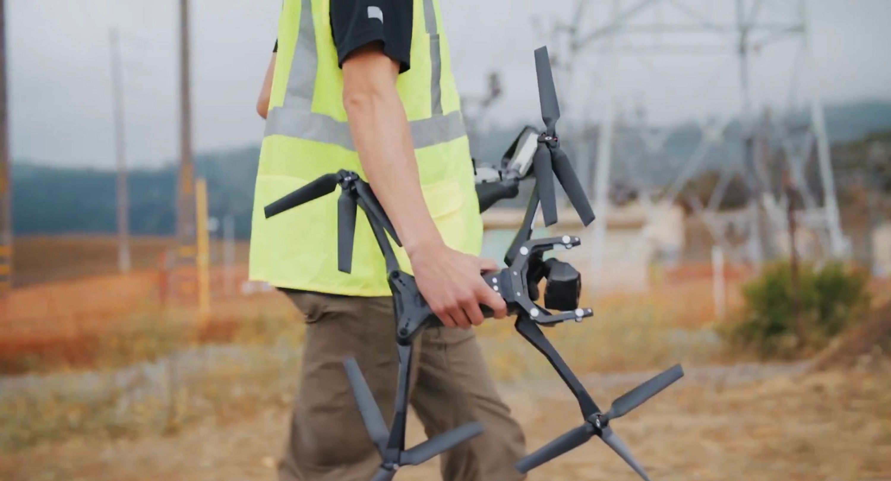 Person arm holding drone