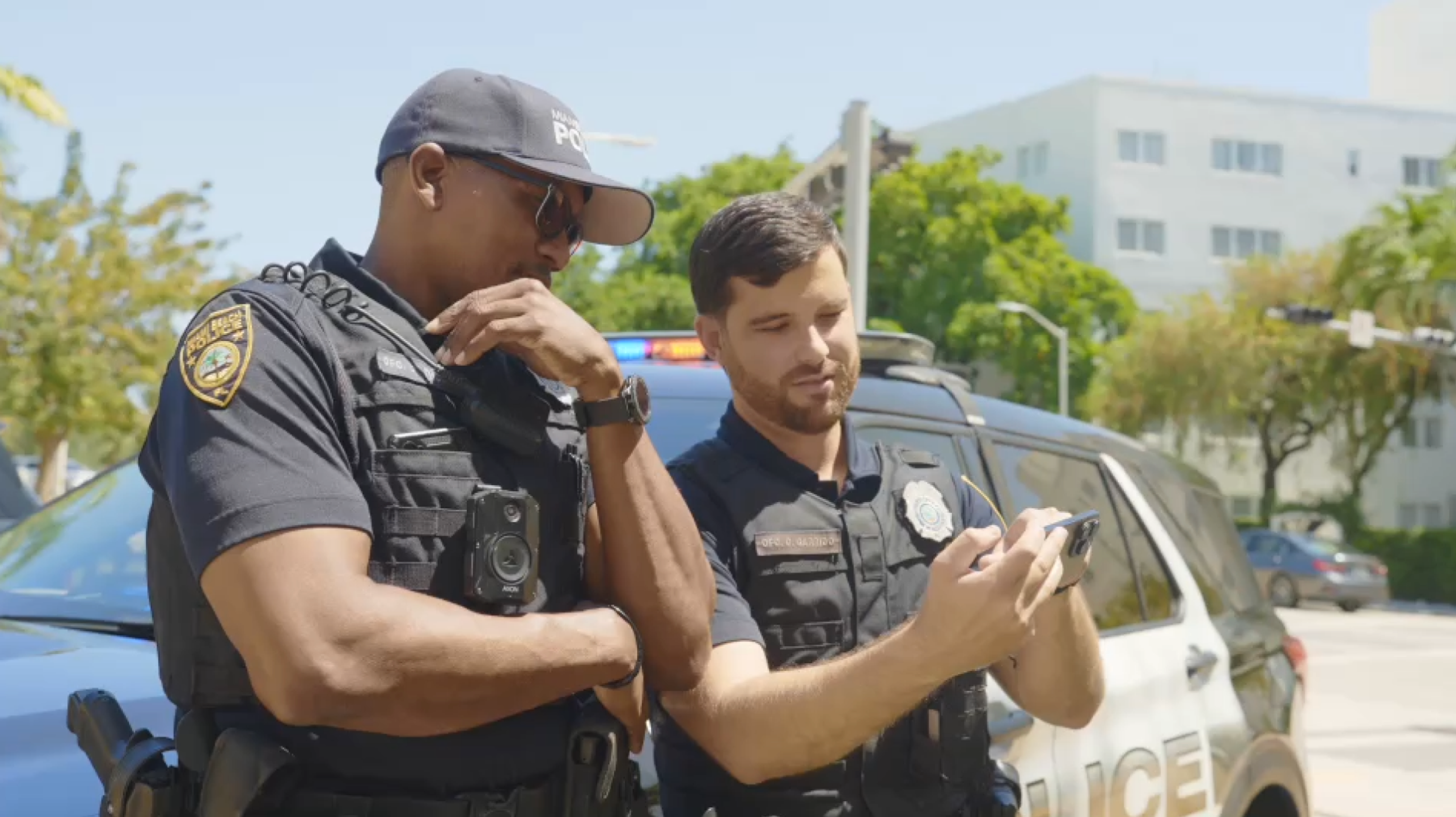 Two policemen using drone controller