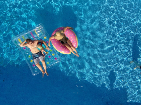 Family in pool from above