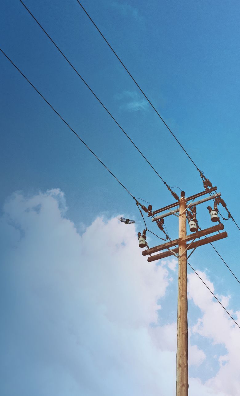 Narrow view of Skydio drone flying around a power line