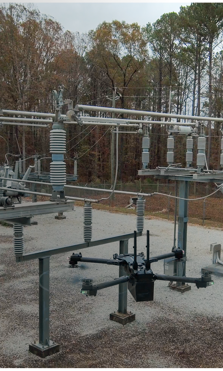 portrait view of a Skydio drone flying in a power substation location