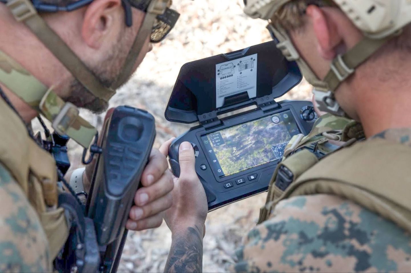 U.S. Marine Corps Sgt. Ellis Eller pilots a Skydio X2D drone during exercise Wallaby Walk 24 in Australia, observed by an Australian Army soldier, May 13, 2024. The exercise enhances EOD skills and interoperability between U.S. and Australian forces. (U.S. Marine Corps photo by Sgt. Cristian Bestul)